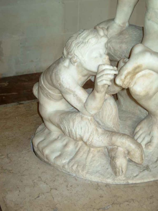 the statue has two small boys hugging