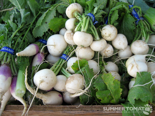 a variety of vegetables for sale at an outdoor market