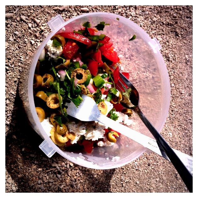 a bowl of food with a fork on top of it