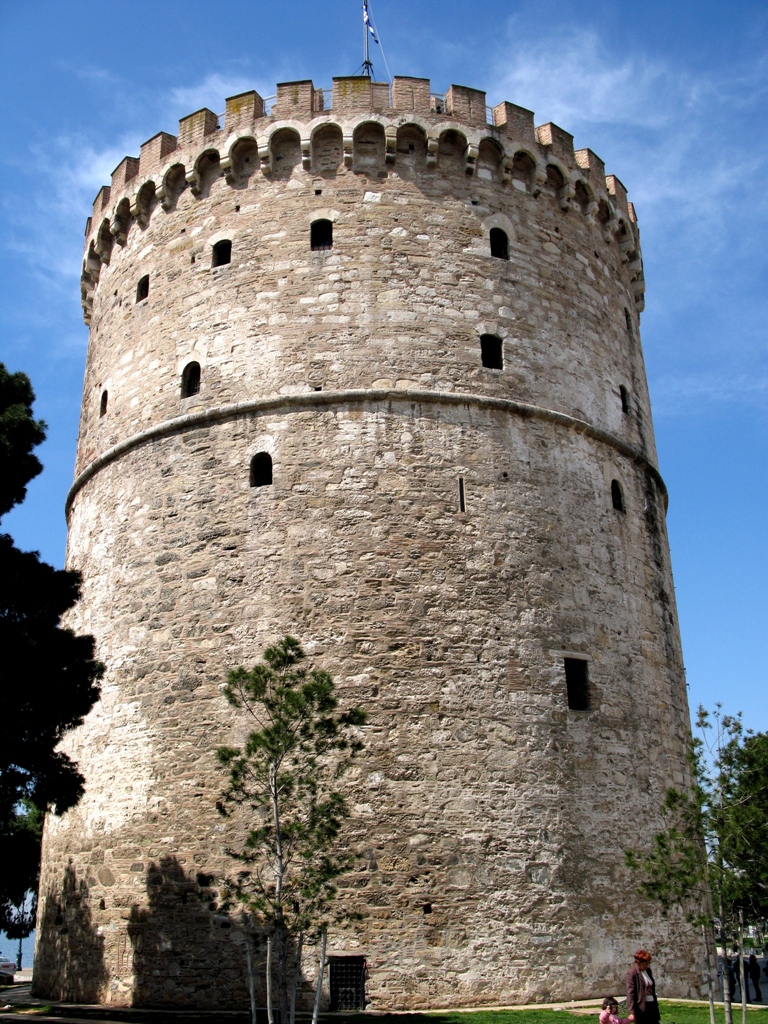 an old tower with several holes in it