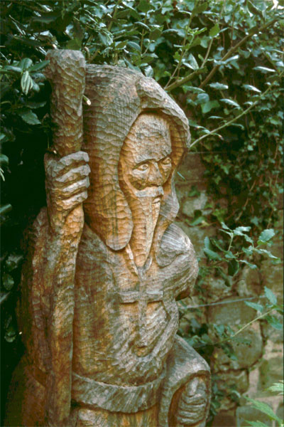 a statue of a person holding a nch