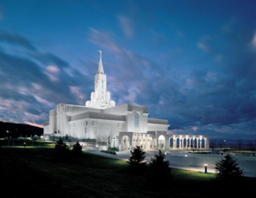 a view of a church at night with lights lit