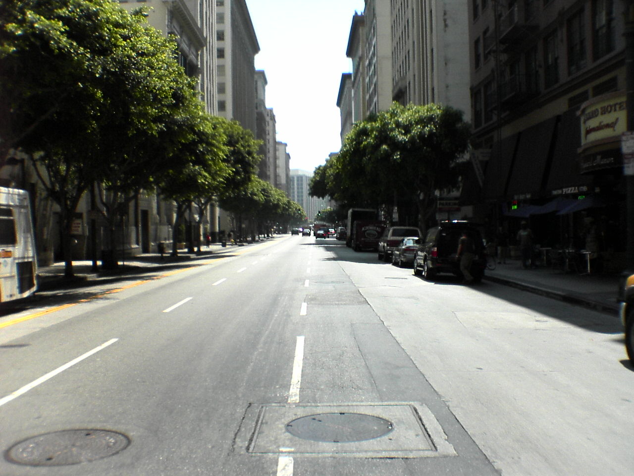 the city street is empty but no cars are moving along