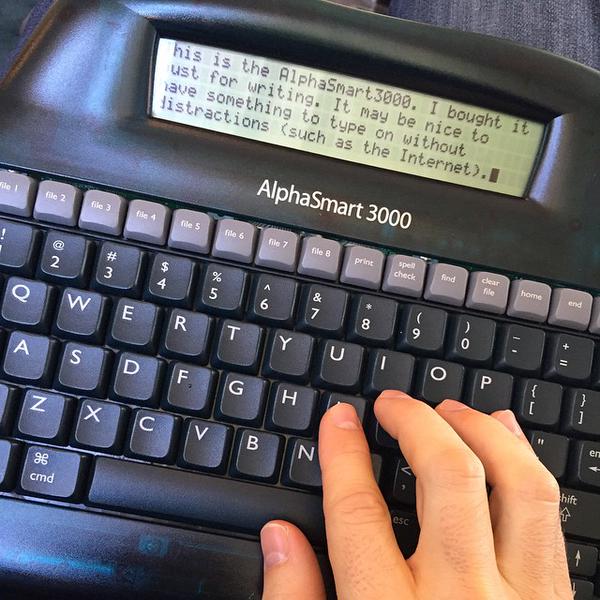 someone is typing on the keyboard while using a computer