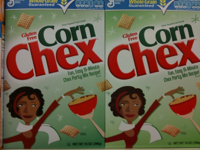 two cereal boxes on the shelf next to each other