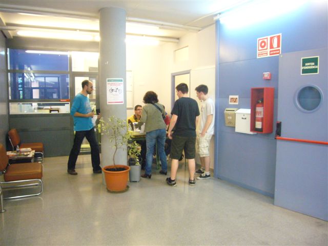 a group of young people standing in a waiting area