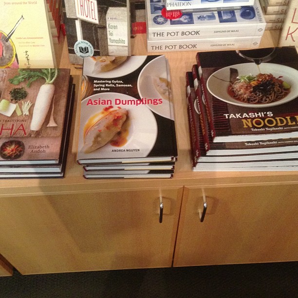 four stacks of asian cuisine books, each with a different sub - cultural name
