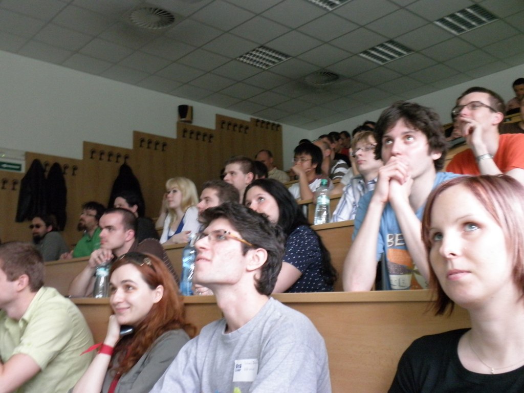 group of students watching lecture in large auditorium