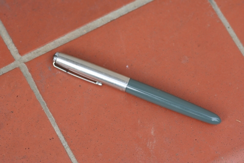 a pen laying on the ground on the floor