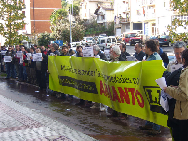 a group of people holding a protest in the street