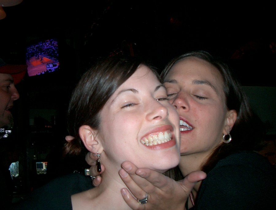 two women sharing a laugh at an event