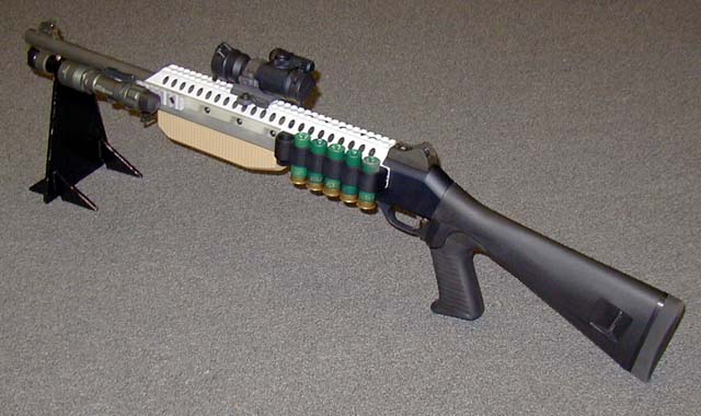 a machine gun with a scope attached to it's stock