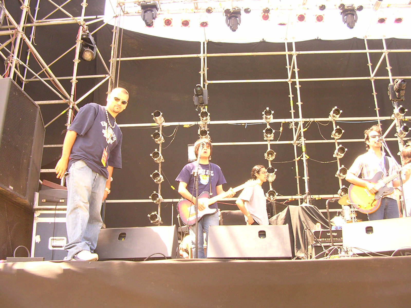 a group of guys that are standing on some stage