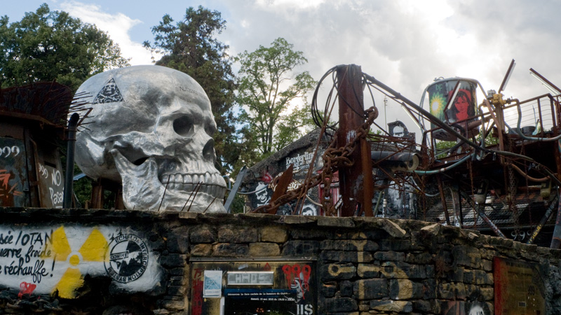 a group of metal sculptures on top of a wall