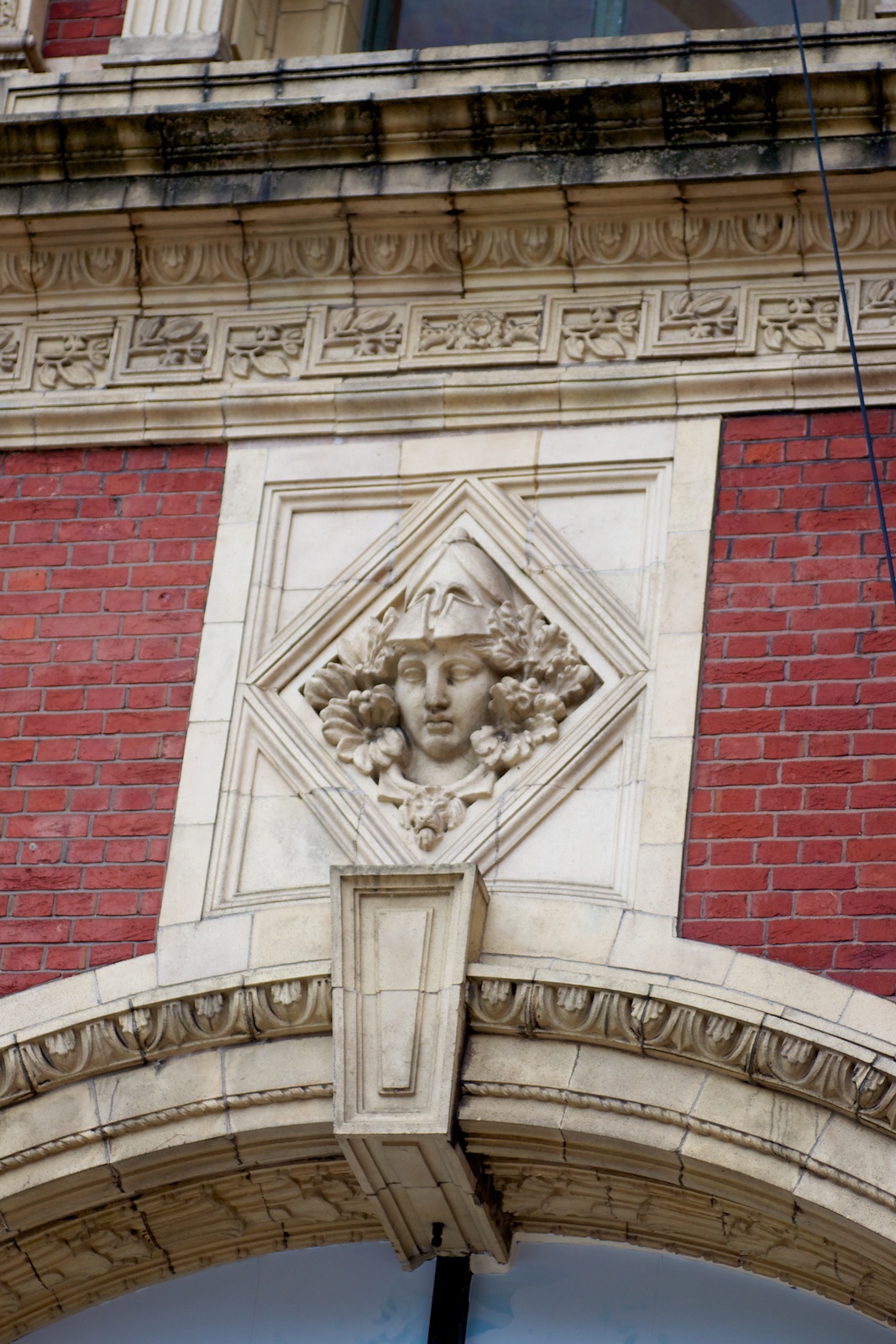 an ornate decorative piece on the outside of a building