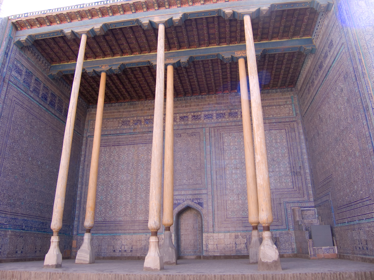 three pillars inside of an intricately decorated building