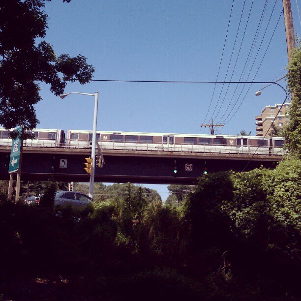 an elevated train on a elevated railway bridge