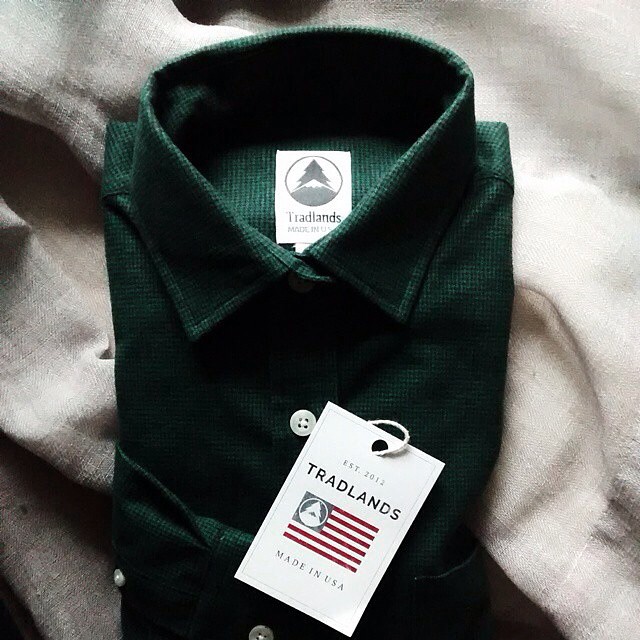 green long sleeve shirt with white stripe on the collar