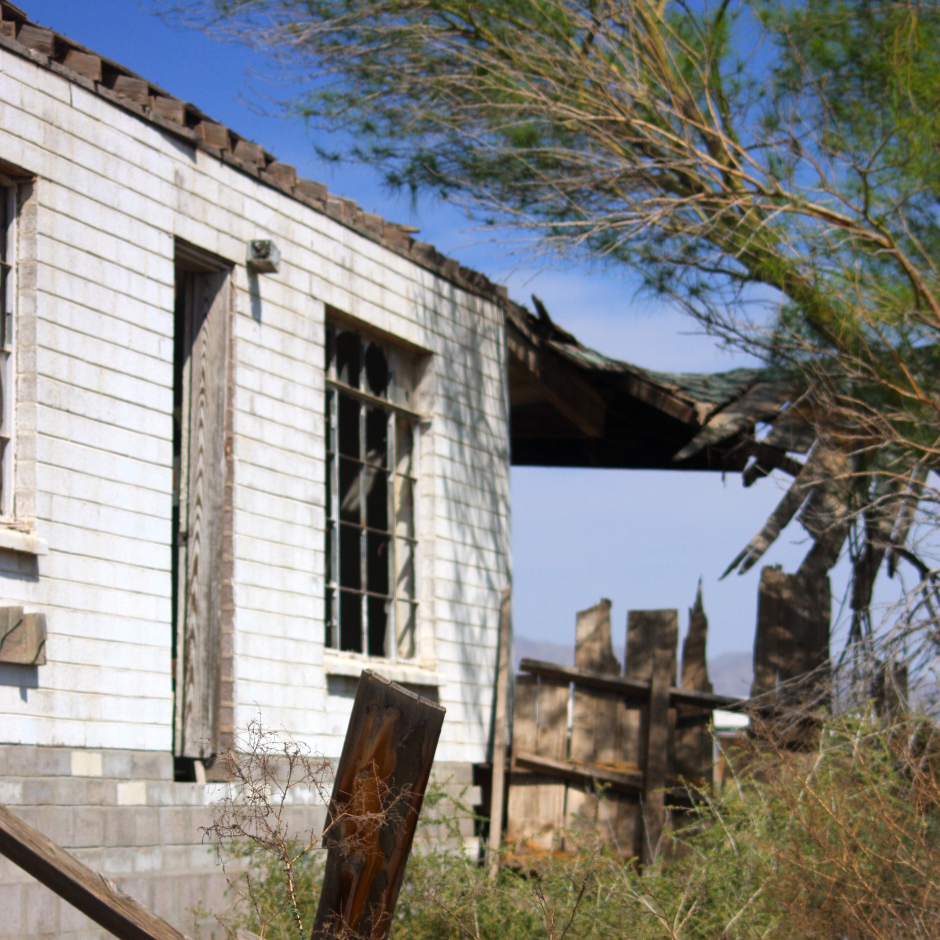 an abandoned home with some broken down pieces