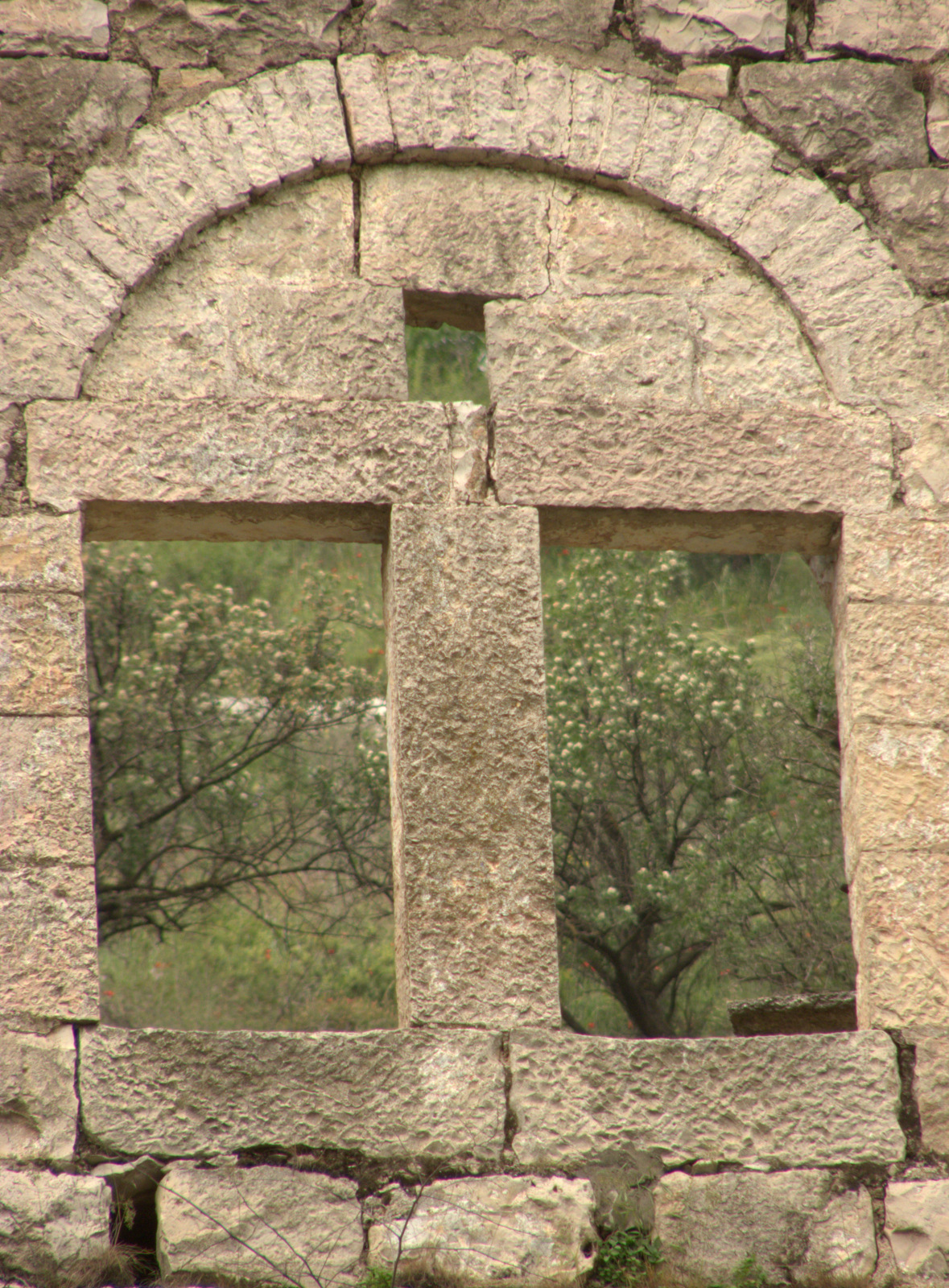 a view from behind the window of an old brick building