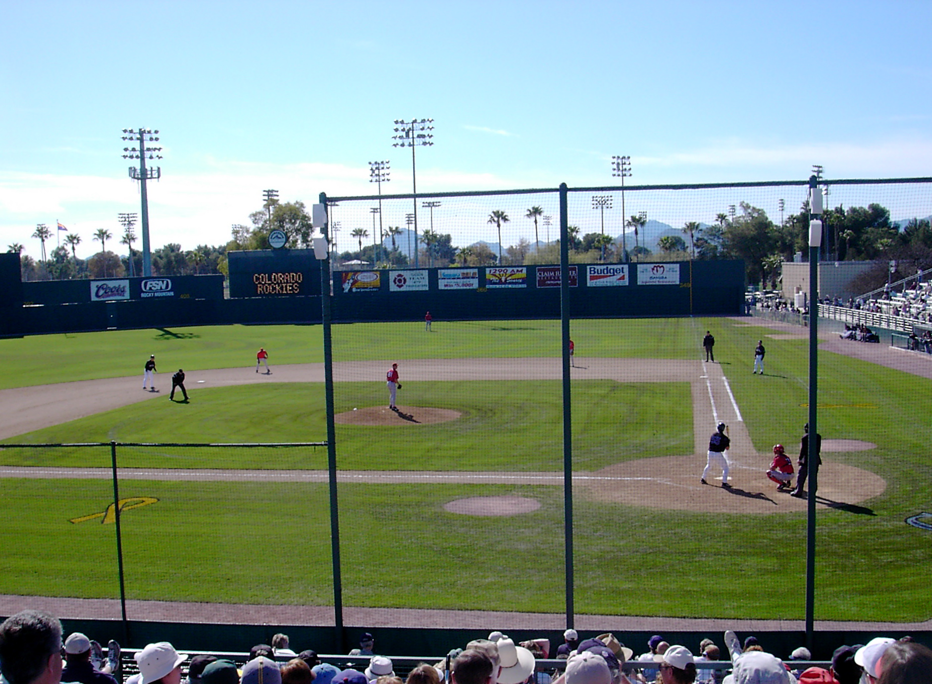 a group of baseball players at the stadium playing baseball