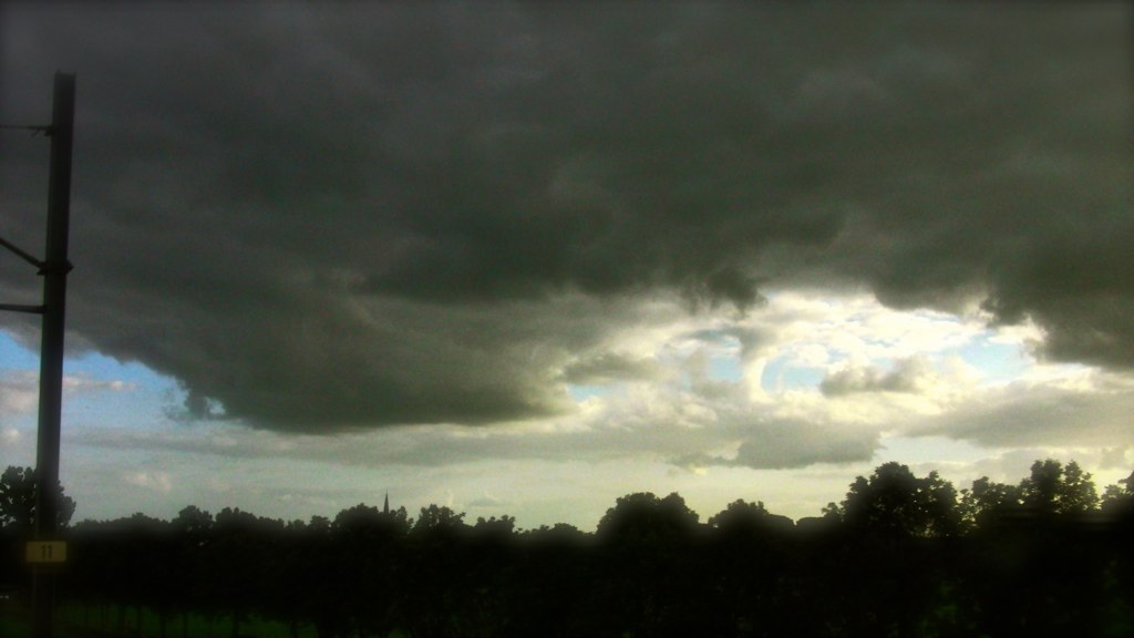 dark, stormy weather moves into a park