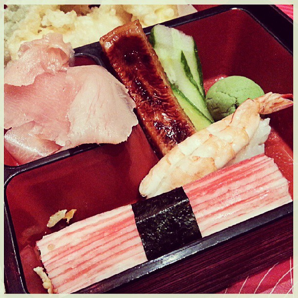 a bento box has a variety of foods inside it