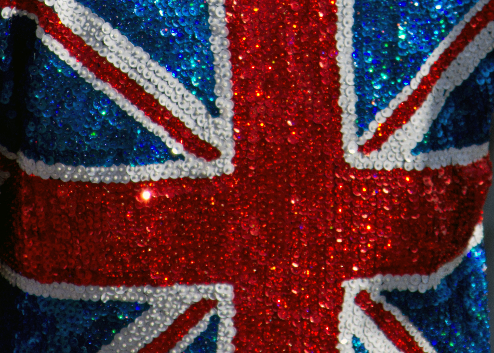 a british flag sequin covered bodysuit in blue and red