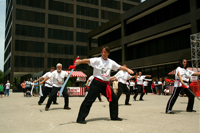 a number of people dressed in various costumes dancing