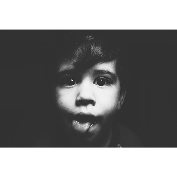 black and white po of a young child making a face