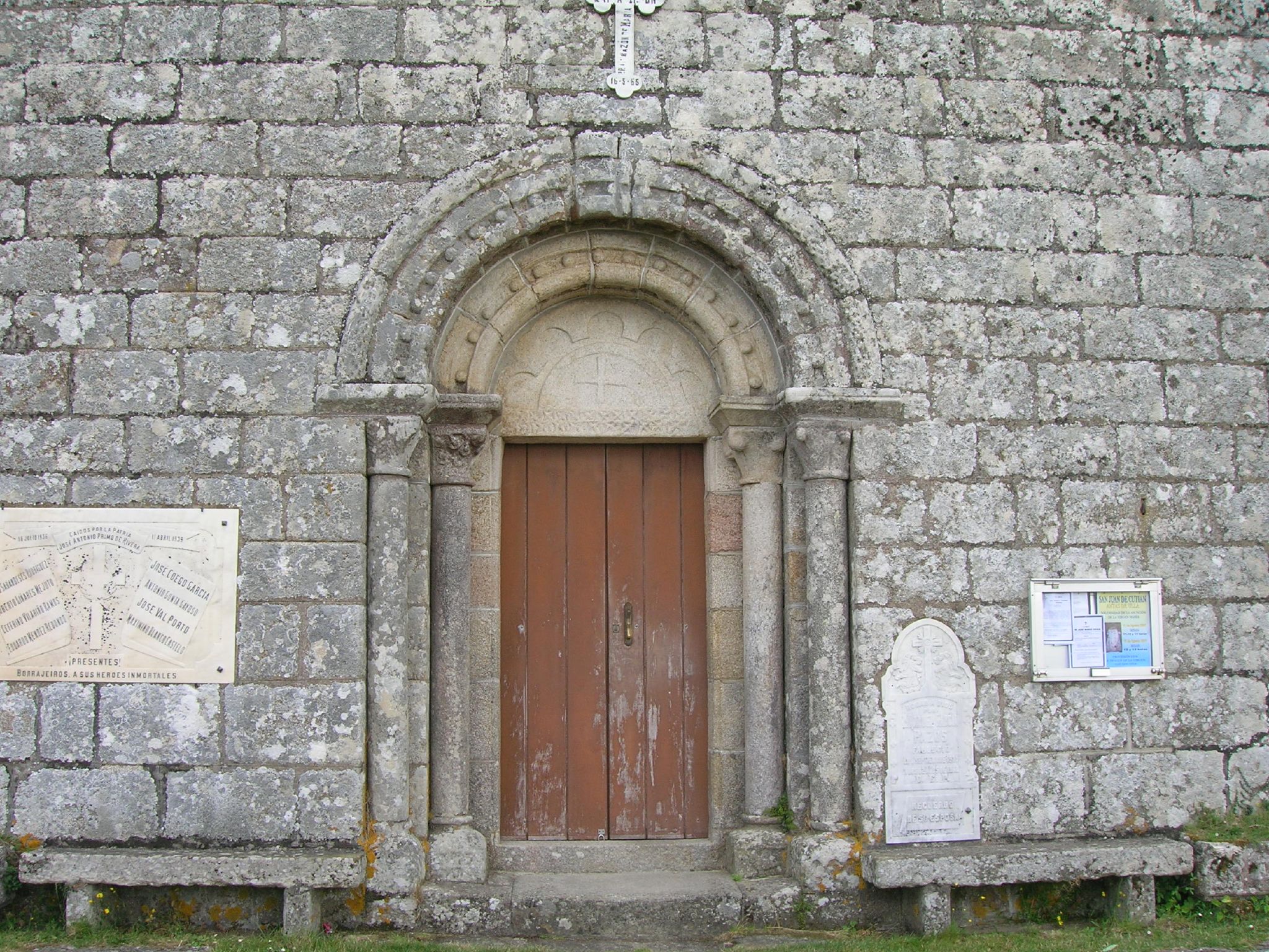 an old brick wall with a doorway