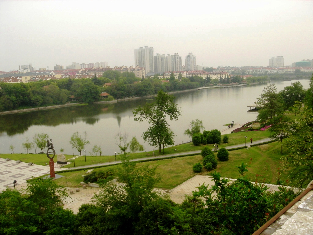 view from a viewpoint point, looking down at a large river and the city