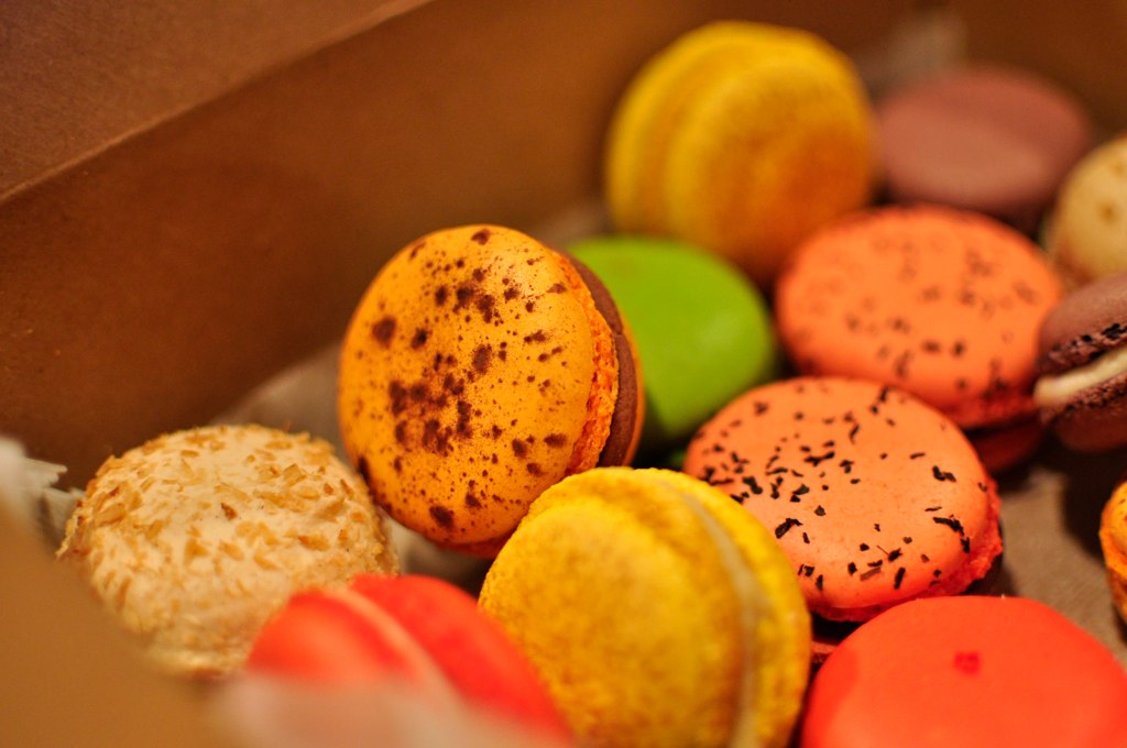 a box filled with lots of colorful pastries