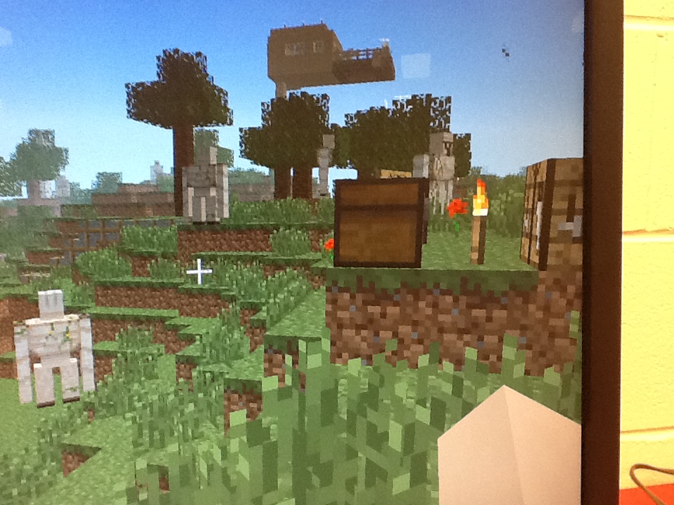 the video game's background is a minecraft landscape