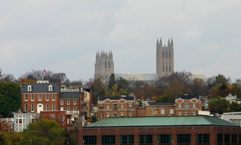 a scenic view of a cathedral towering over the city