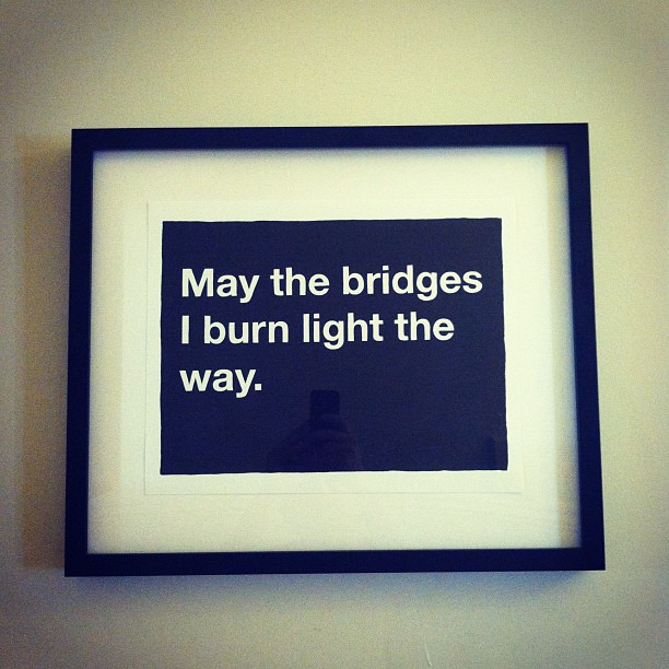 framed message reading, may the bridges i burn light the way