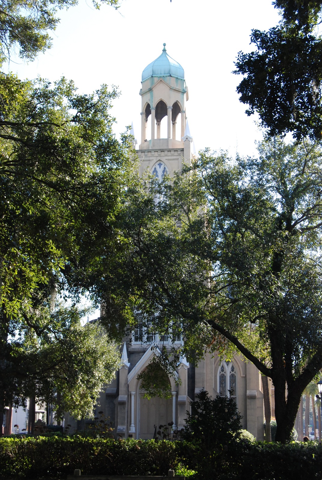 a church tower with blue domes on a sunny day