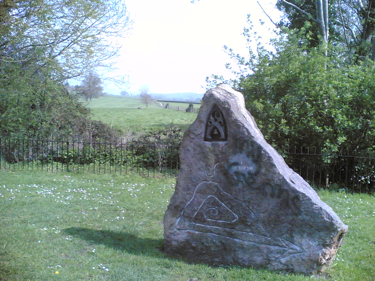 an image of a stone with a triangle and letter