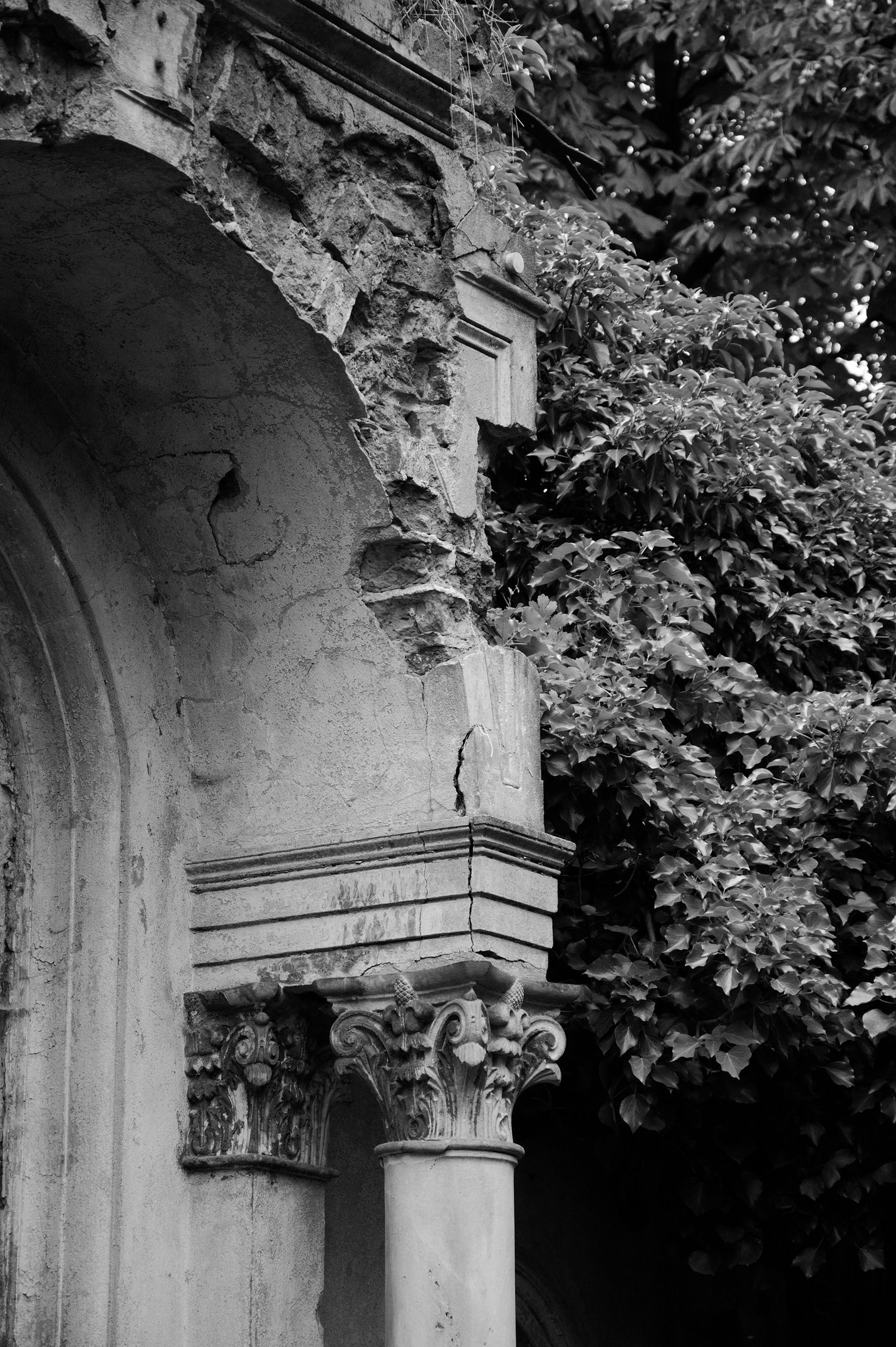 an old, ruined building with a column