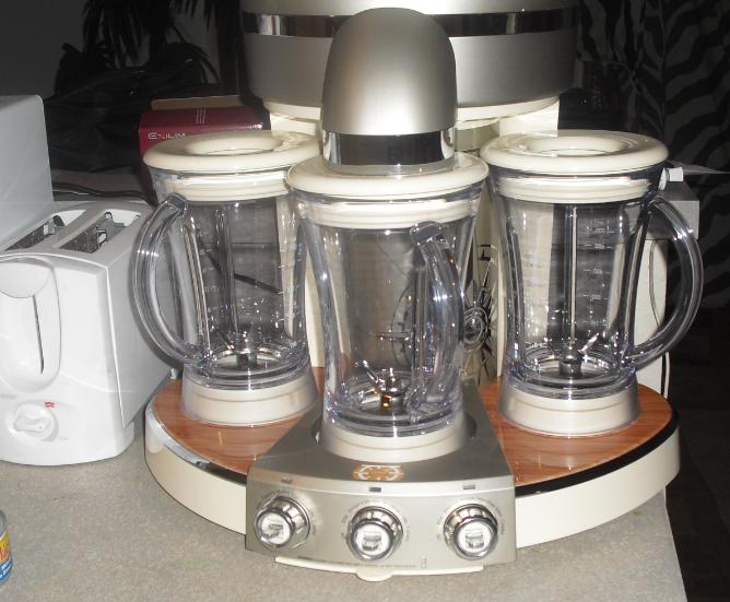 a group of blenders sitting on top of a counter