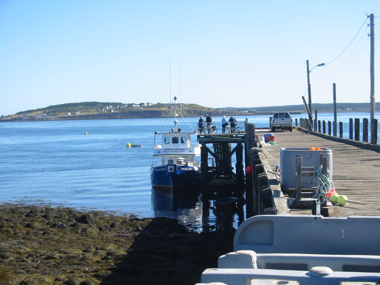 the boat is sitting docked near a dock