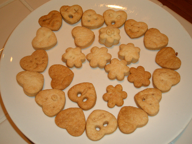 small and big cookies laid out on a white plate