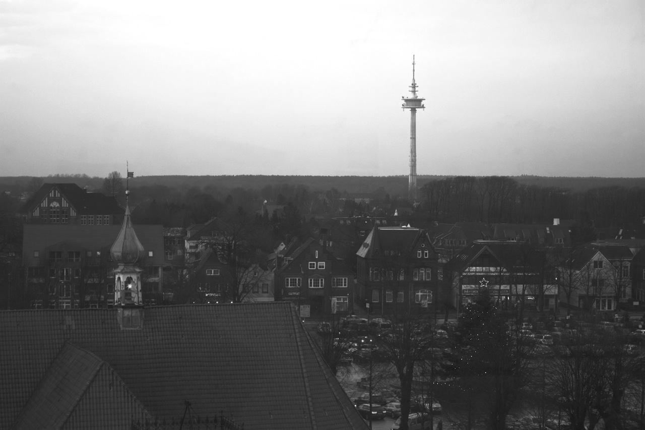 view from the rooftop of buildings looking at the tv tower