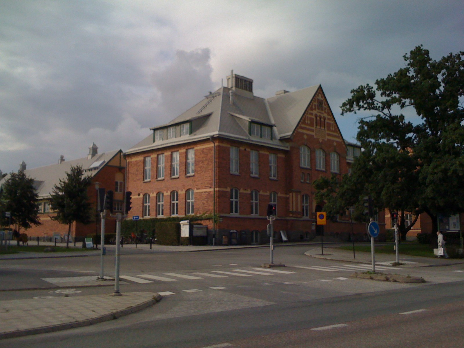 a red brick building on the corner of an intersection