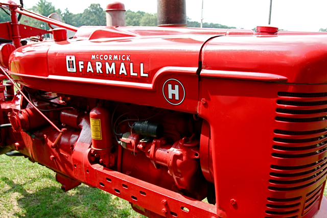 the front end of a red farmall tractor