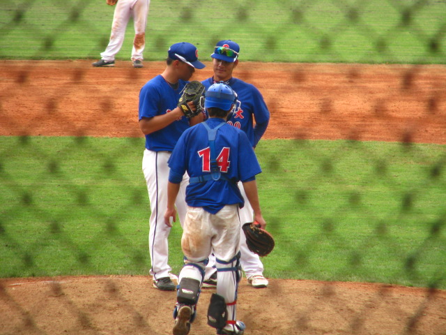 a group of baseball players congratulate each other