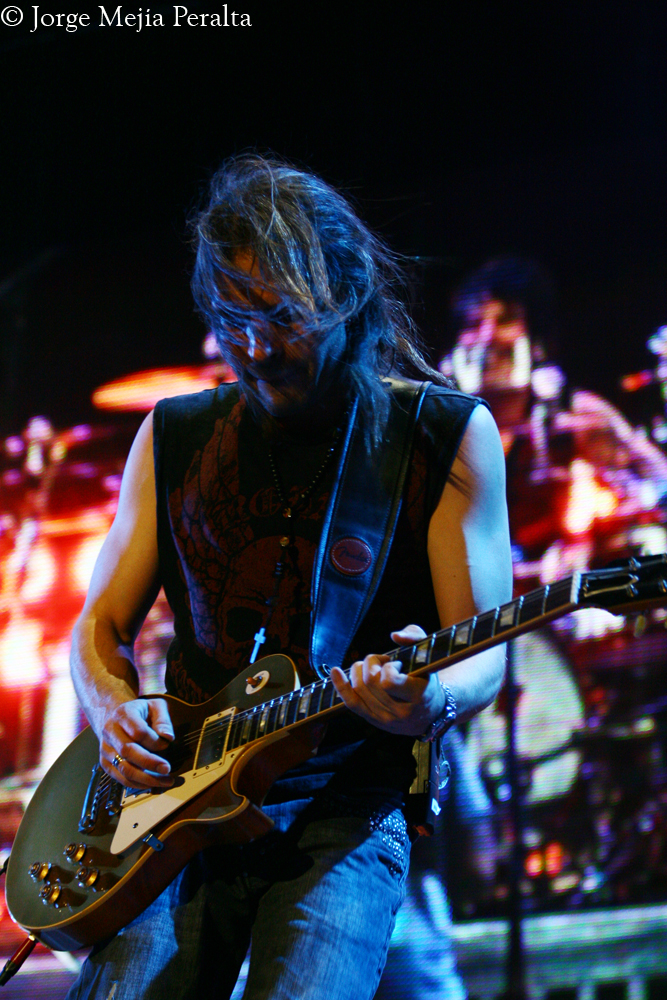 the guitarist is playing his guitar for a concert