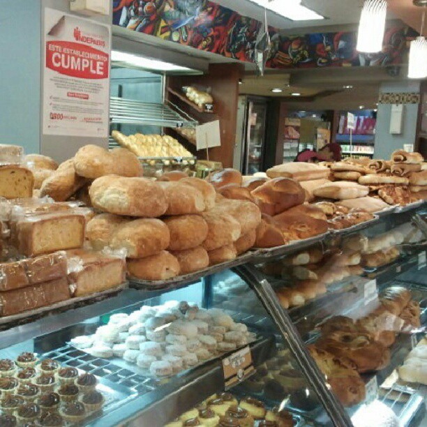 a bakery filled with lots of breads and pastries