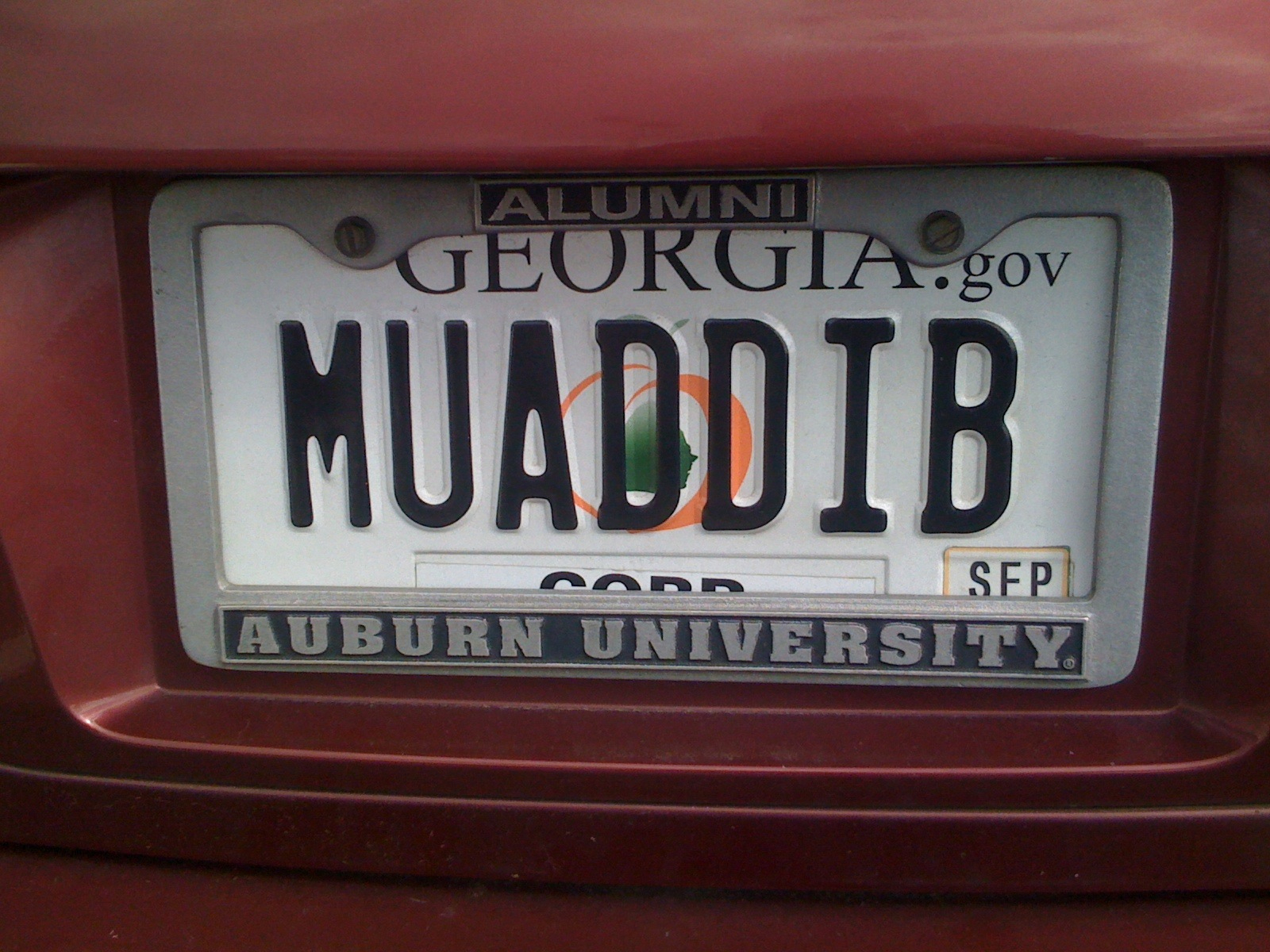a license plate of a university from a car