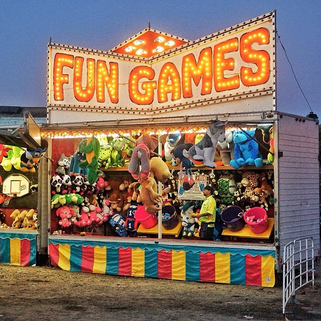 a fun games booth set up at an outdoor amut park